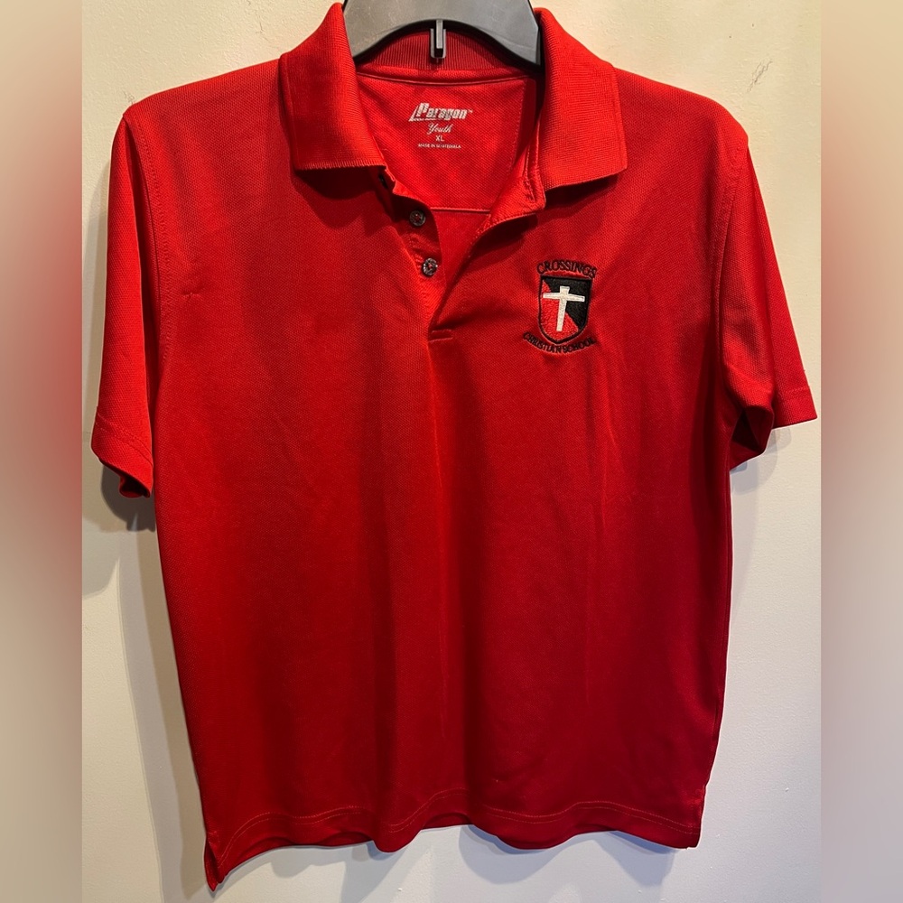 PARAGON Red Youth Polo Shirt with small school logo.